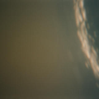 Blurry analog photography under river water. Shades of dark brown, navy and cream.
